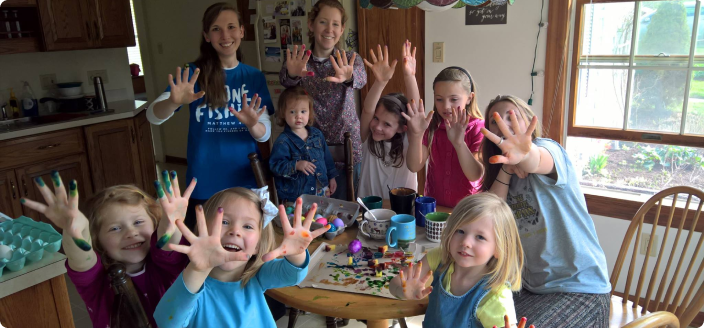 Kids waving after doing crafts